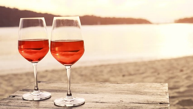 Two glasses of wine on the beach